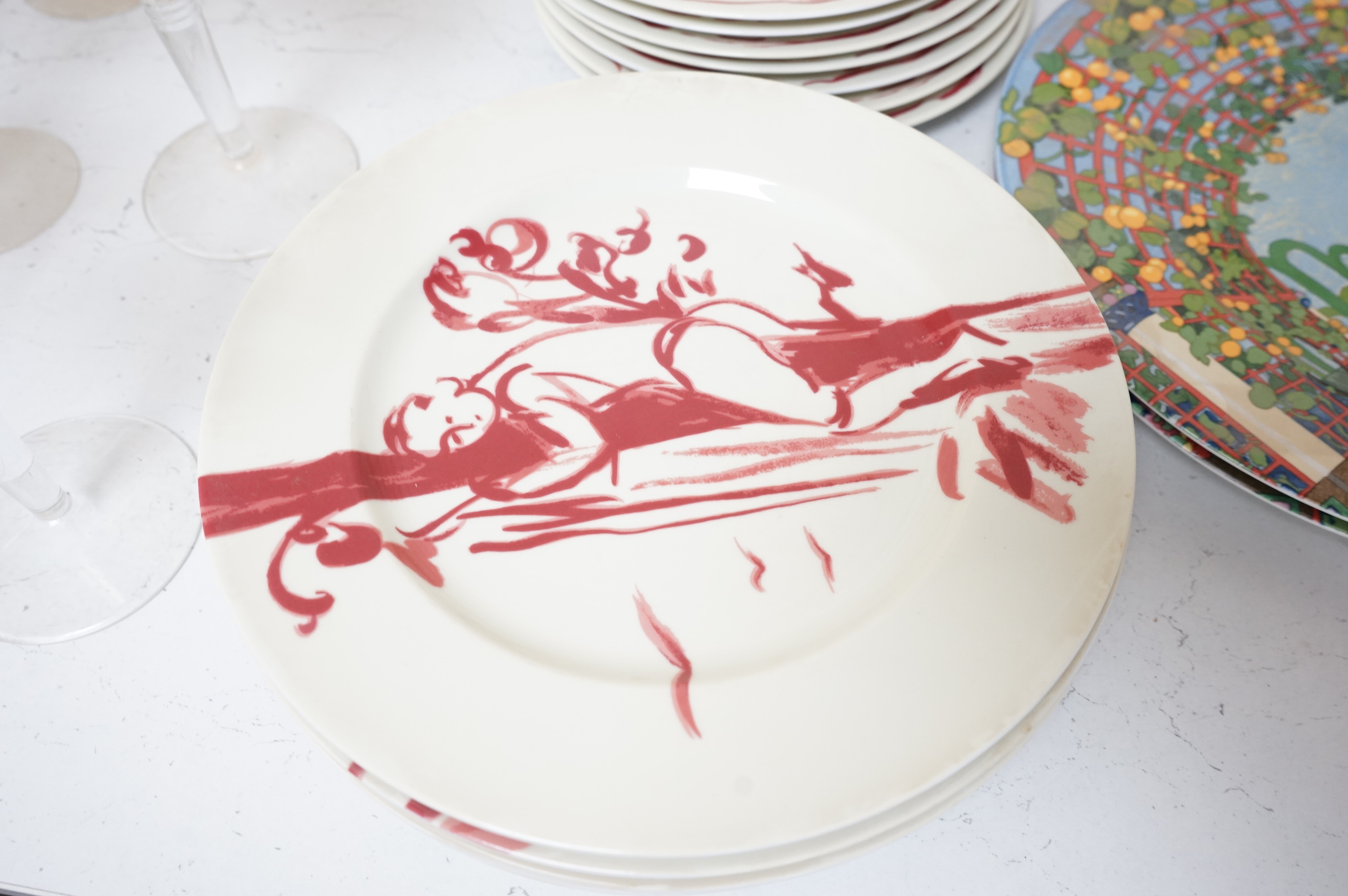 A Pierre Frey ‘Gonesse’ Limoges part dinner service, two Villeroy and Boch ‘Jardins Francais’ dinner plates, with a collection of Riedel wine glasses and mixed Salviati champagne glasses. Villeroy and Boch plates 30.5cm